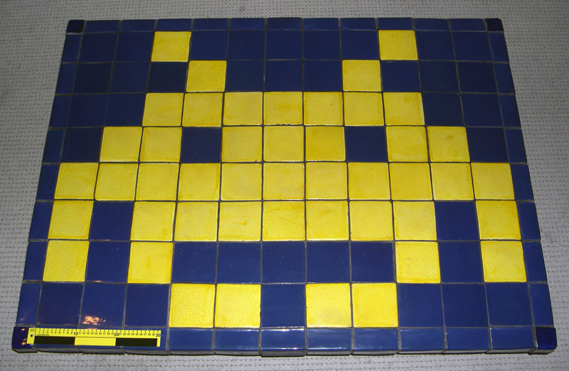 Table surface, with scale, showing tiling pattern.
