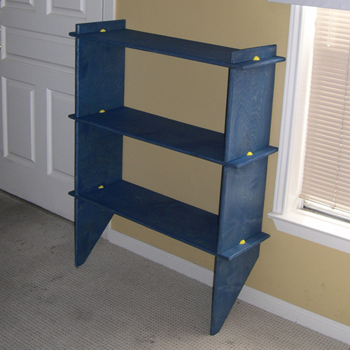 Puzzle shelves stained, oiled, and assembled with special joints.